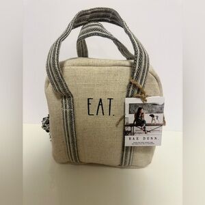 Rae Dunn Lunch box in Cream with the Word "EAT" on the front. NWT